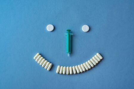stylized image of syringes, capsules, and tablets. Concept of children's health