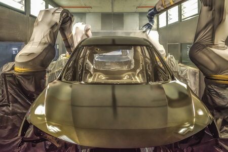 Production line of automobile plant, paint shop. Car body after applying the base paint.の写真素材