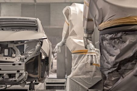 Production line of automobile plant, paint shop. Car body after applying the base paint.の写真素材