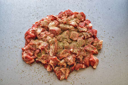 Chunks of raw meat on a gray table. Pork for the grill.の写真素材
