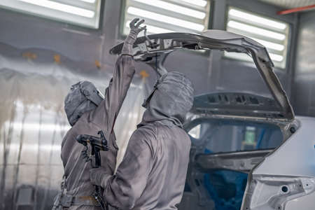 employee shop painting the car body produces painting elements of the interior of the car close-up.の写真素材