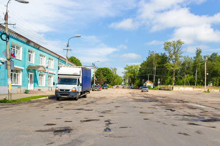 Sychovka, Smolensk, Russia - June 17, 2016: Holes and cracks in the asphalt country road in the small russian villageのeditorial素材