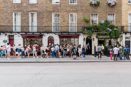 London, UK â€” July 24, 2018: A long queue for to the Sherlock Holmes Museum in London