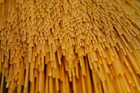 A large pack of Italian yellow spaghetti folded hardlyの写真素材