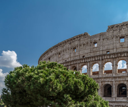 Colosseum amphitheater in Rome, against the blue sky