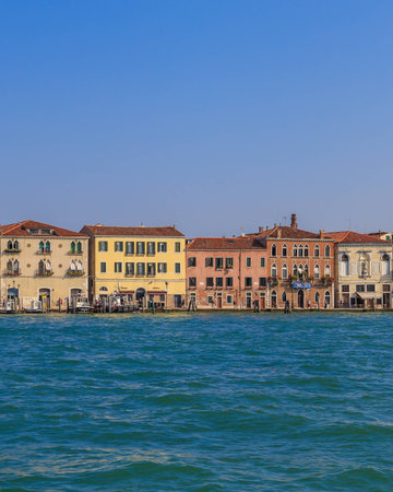 Colorful weathered facades of old venetian buildings, sunny dayの写真素材