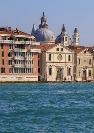 Colorful weathered facades of old venetian buildings, temples domesの写真素材