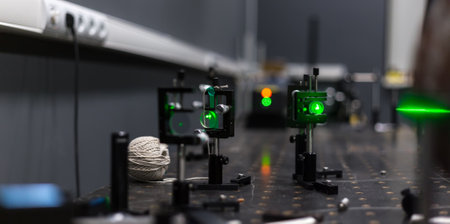 green lasers in the laboratory, laser beams among the optical elements, the study of light and cognitive phenomenaの写真素材
