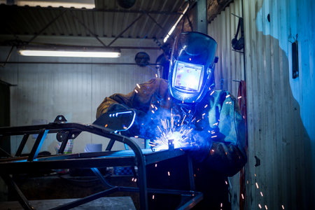 welder weld assembles metal work