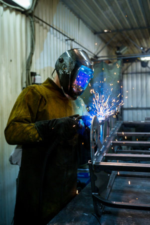 welder weld assembles metal work