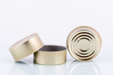 tin cans on white background with reflection