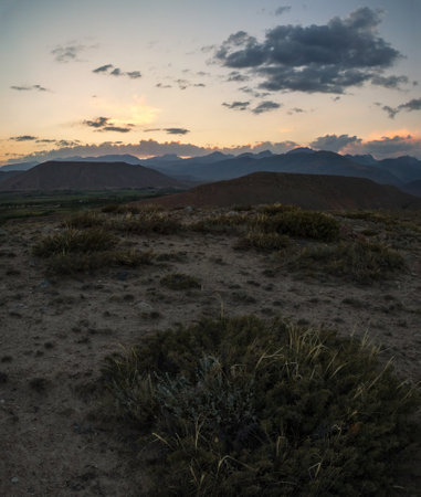 foothills at sunset, mountain ranges of Kyrgyzstanの写真素材
