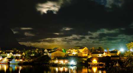 view of the Reine village at night, Lofoten islands, Rorbu in the light of lanterns