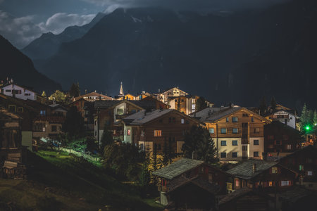 view of a village in switzerland, night landscape in the mountainsの写真素材