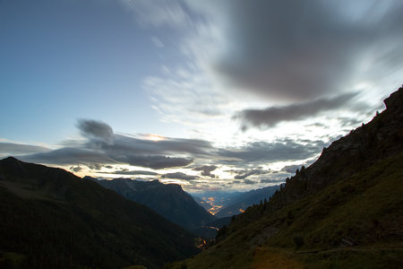 view of the valley in the mountains after sunsetの写真素材