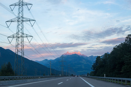 Asphalt road in Switzerland, road between the Alps mountains