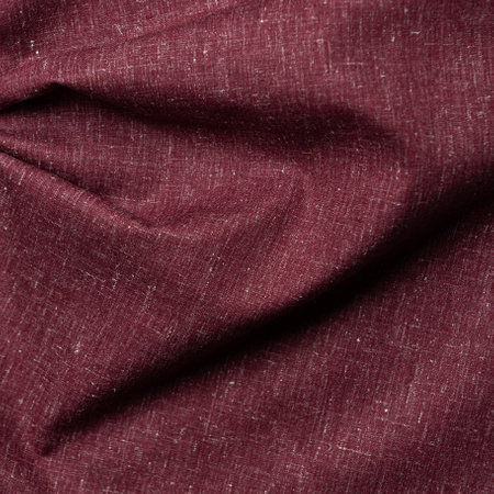 Crumpled burgundy fabric as a background. Macro texture.の写真素材