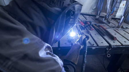 manual welding of metal with plasma in production