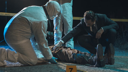 Detective and forensic scientists working hard at crime scene near headless body. Collection and...