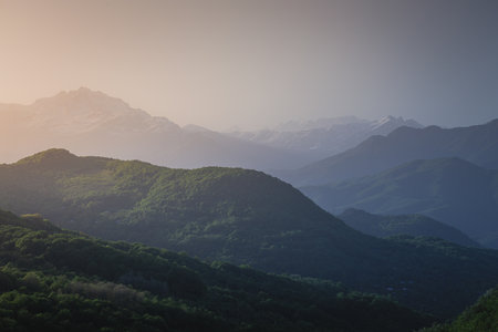 mountain ranges at sunset in the haze
