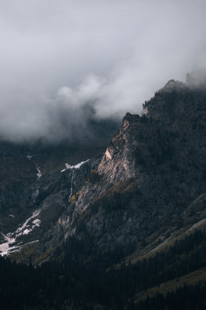 Mountains in the clouds, waterfall in the harsh mountains of Georgiaの写真素材