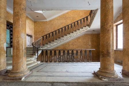 beautiful vintage staircase and columns in abandoned hotelの写真素材