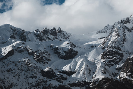 Snowy mountain peak in clouds, Mount Ushba in Georgia