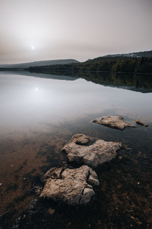 sunrise on a mountain lake, cloudy weather, Shaori Reservoir Georgiaの写真素材