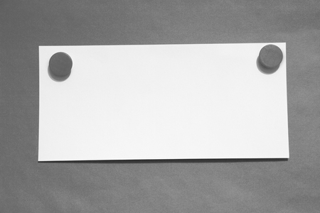 Note with magnets, grey backgroundの写真素材