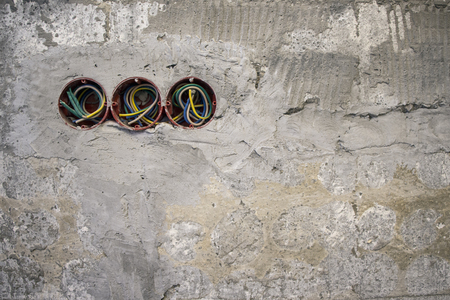 socket plastic boxes and electrical cables on the wall. backgroundの写真素材