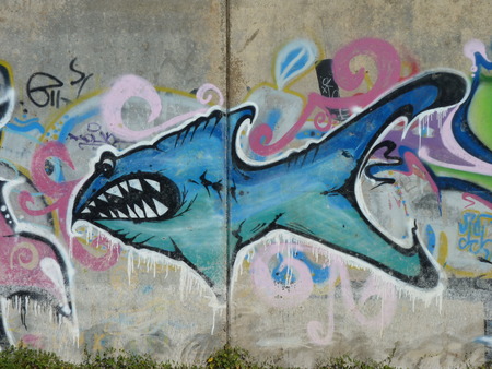 Toothy fish - graffiti on embankment walls in the city of Volgogradのeditorial素材