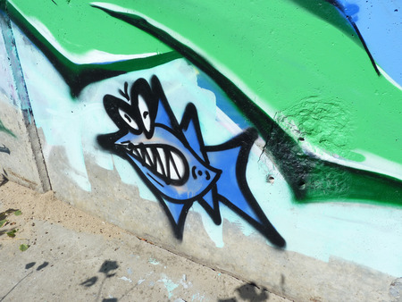 graffiti Toothy fish on embankment walls in the city of Volgogradのeditorial素材