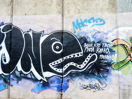 Toothy black whale with an inscription \\\"Know, who your father Carlo, a log!\\\"のeditorial素材