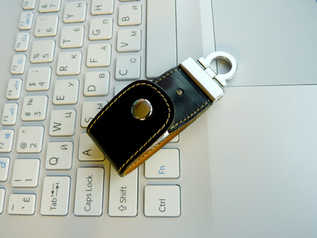 The elite store of memory in leather cover on the laptop keyboard