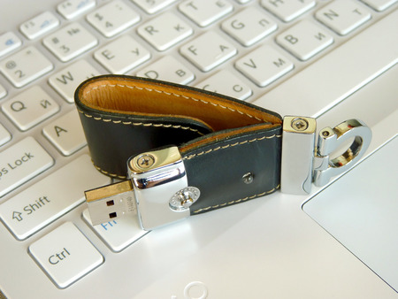 The elite store of memory in leather cover on the laptop keyboard