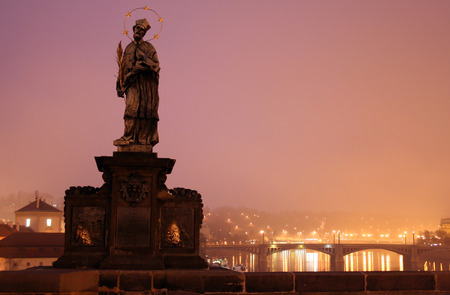 Sculpture sacred John Nepomucene on Karlovy Bridge in the city of Prague at sunriseの写真素材