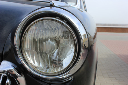 Headlight on the legendary Soviet Volga retrocar of GAZ21