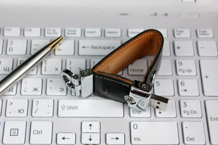 Elite store of memory in leather cover on the laptop keyboard