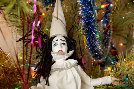 Toys in the form of Santa Claus and Piero under a New Year treeの写真素材