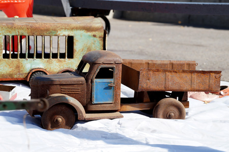 Old rusty toy for in the form of the truckの写真素材