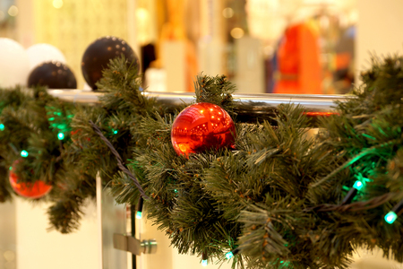 Christmas decoration of shopping center spheres, bows and branches of a fir-treeの写真素材