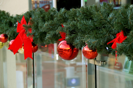 Christmas decoration of shopping center spheres, bows and branches of a fir-treeの写真素材