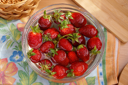 Fresh crop of strawberry from the Russian giving in capacity with waterの写真素材