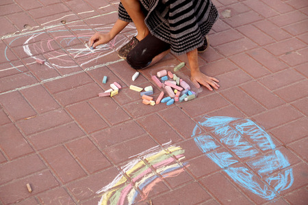 Drawing by crayons on asphalt in city parkの写真素材