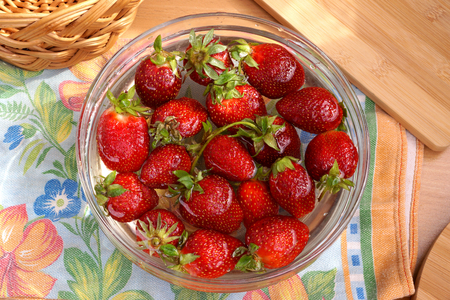 Fresh crop of strawberry from the Russian giving in capacity with waterの写真素材