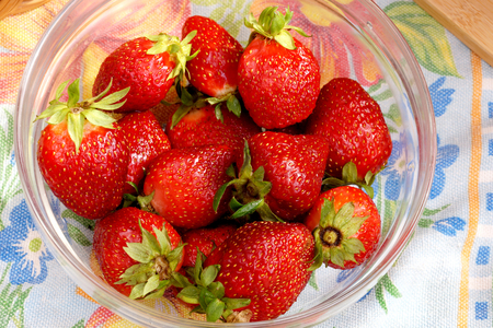 Fresh crop of strawberry from the Russian giving in a transparent salad bowlの写真素材