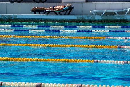 Dividers of paths in the big outdoor swimming poolの写真素材