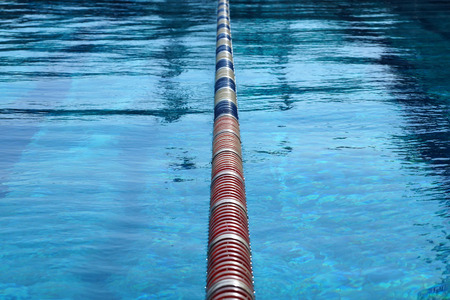 Dividers of paths in the big outdoor swimming poolの写真素材
