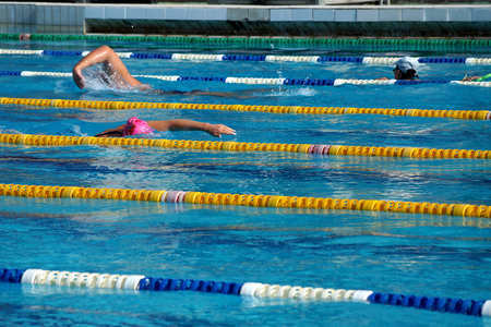 Girl swimmer in the outdoor swimming poolの写真素材