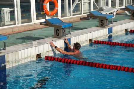 Swimmer in the big outdoor swimming poolの写真素材